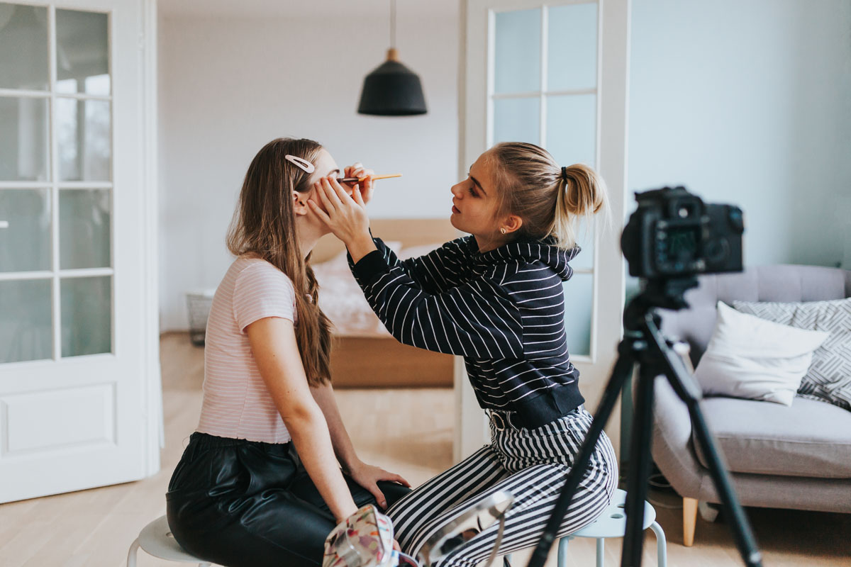 Next Balance Two teenage influencers doing eye make-up web show Next Balance